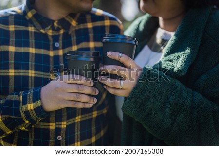 Couple Drinking Coffee on a date cold winters morning