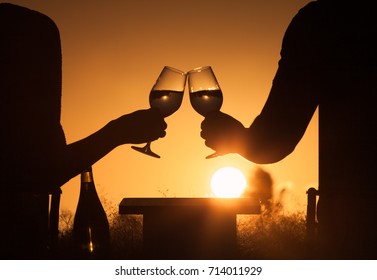 Couple Drinking Glass Of Wine Together. Happy Life Moments. Cheers At Sunset.  