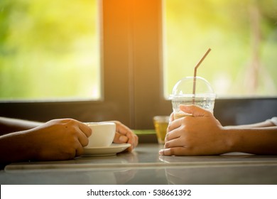 Couple Drinking Hot And Cold Coffee