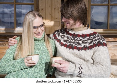 Couple drinking tea at chalet - Powered by Shutterstock