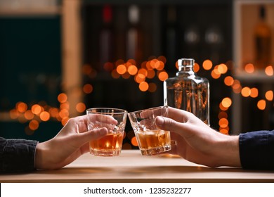 Couple Drinking Whiskey In Bar