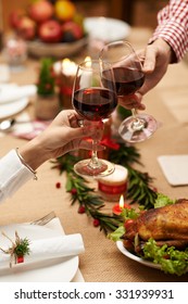 Couple Drinking Wine At Christmas Celebration