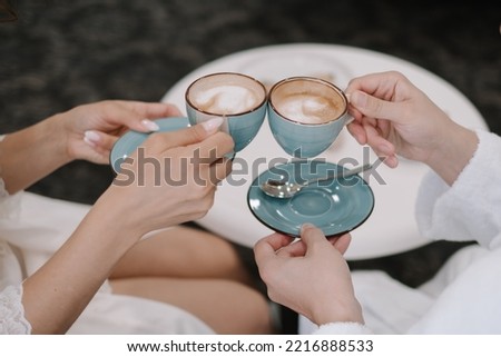 A couple drinks coffee together at breakfast. Morning cup of coffee. 