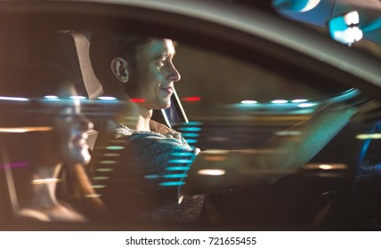 The Couple Drive A Car. Evening Night Time