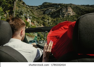 A Couple Drive A Car In Positano, Amalfi Coast, Italy