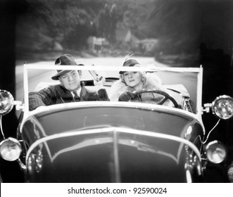 Couple Driving A Car