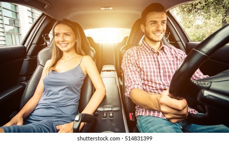 Couple Driving In A Sport Car