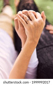                        Couple During Engagement Photo Session At The Park        