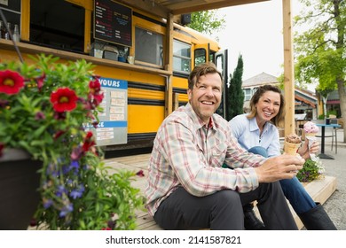 Couple eating ice cream at food truck - Powered by Shutterstock