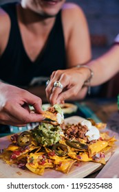 Couple Eating Street Tacos And Nachos At Outdoor Mexican Restaurant. Mexican Food.