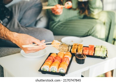 Couple Eating Take Out Food At Home. 