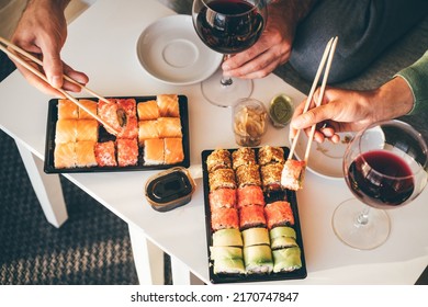 Couple Eating Take Out Food At Home. 