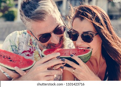 Couple Eating Watermelon At The Beach