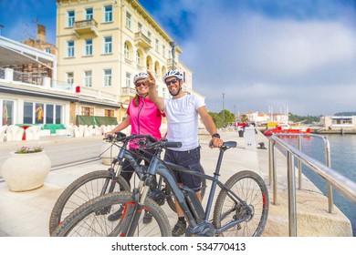 Couple With An Ebike In Holidays