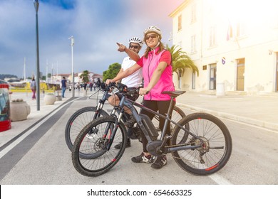 Couple With An Ebike In Holidays