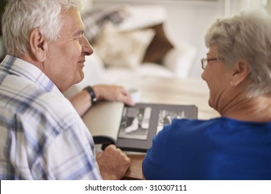 Couple of elder couple reminiscing their past - Powered by Shutterstock