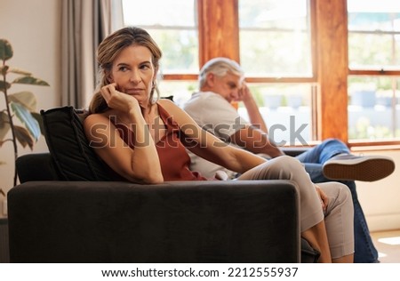 Couple, elderly and angry on sofa for argument, fight or dispute in home together. Stress, sad and frustrated with silence on couch in living room at house with senior, man and woman with depression