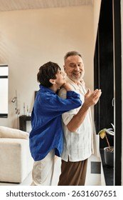 A couple embraces with warmth and laughter while enjoying their time together at home.