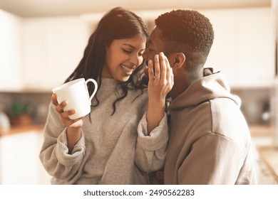 Couple Enjoying Coffee and Intimacy in Kitchen - Powered by Shutterstock