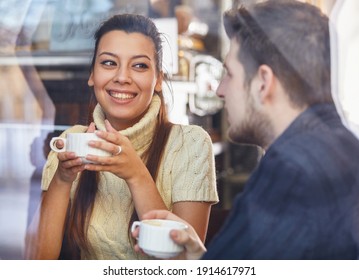 Couple enjoying coffee. Portrait of a happy couple