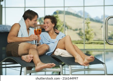 Couple Enjoying A Drink In A Hotel Spa