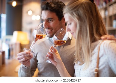 couple enjoying and drinking wine at tasting - Shutterstock ID 2138425717