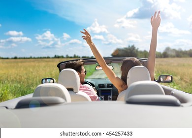 Couple enjoying a drive in a convertible
 - Powered by Shutterstock