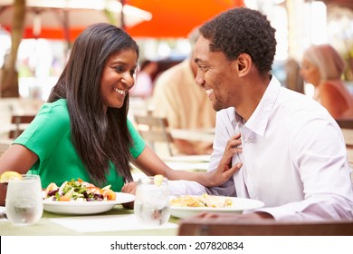 Couple Enjoying Lunch In Outdoor Restaurant