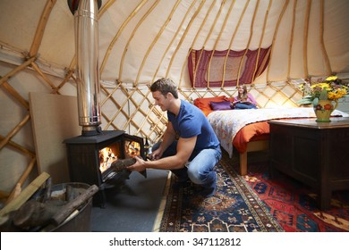 Couple Enjoying Luxury Camping Holiday In Yurt