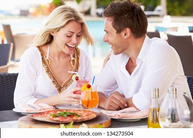 Couple Enjoying Meal In Outdoor Restaurant - Powered by Shutterstock