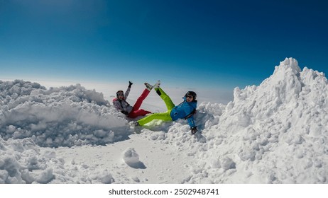 Couple enjoying panoramic view from ski resort Koralpe in Lavanttal, Carinthia Styria, Austria. Winter wonderland on high alpine terrain, Austrian Alps. Valley covered in clouds. Romantic atmosphere - Powered by Shutterstock