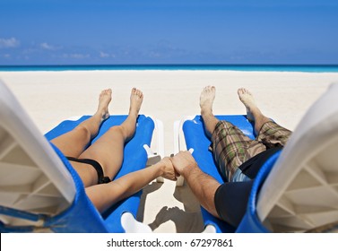 Couple enjoying Peace, love and tranquility on a secluded beach