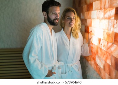 Couple Enjoying Salt Room Therapy At Spa Resort