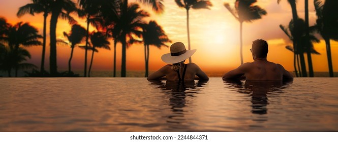 couple enjoying sunset from infinity pool at tropical Bali island resort hotel. romantic beach getaway holiday. banner with copy space - Powered by Shutterstock