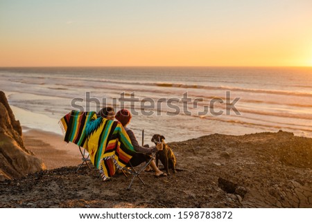 Similar – Image, Stock Photo Couple enjoys a sunset picnic on the rooftop