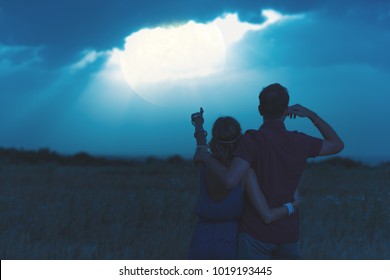 Couple enjoying under the moonlight in nature. My astronomy work.