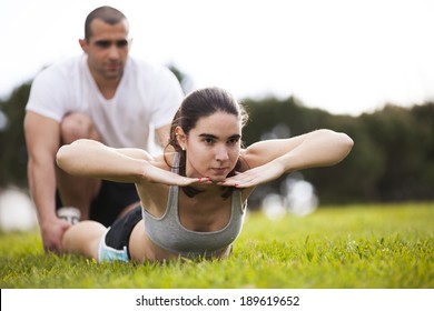 Couple exercising at the city park - Powered by Shutterstock