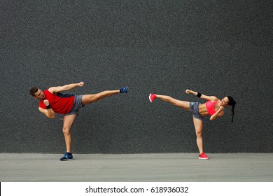 Couple Exercising Side Kick .