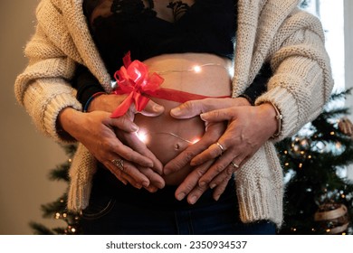 couple expecting a new birth at christmas