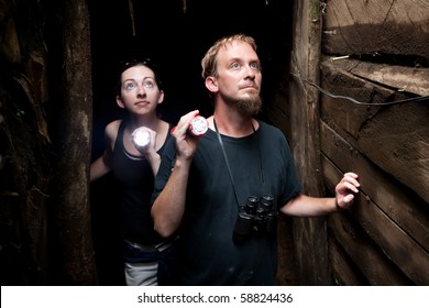 Couple exploring rustic abandoned gold mine in Costa Rica - Powered by Shutterstock