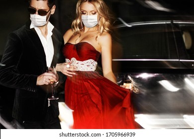 Couple In Face Mask Near The Car.