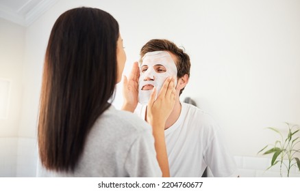 Couple Facial In Bathroom, Beauty Mask Cleanser On Man Face And Skincare Wellness Product. Cosmetic Cleaning, Young Marriage Together And Beautiful Woman Showing Self Love And Relax In Home Together