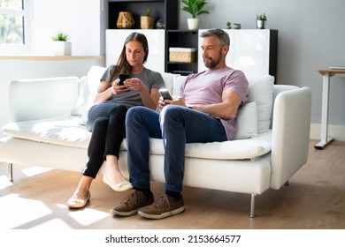 Couple Family Holding Mobile Phones In Hand. Smartphone Texting