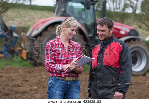 Couple of farmers\
discussing about to do\
list