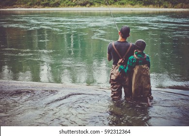 A Couple Fishing In The River 