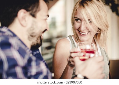 Couple Flirting At The Bar