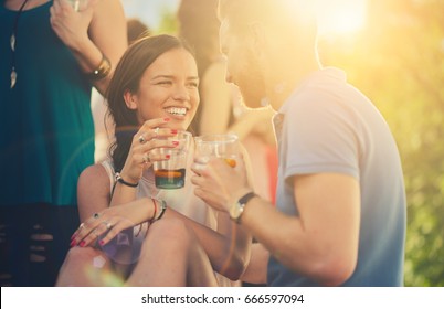 Couple flirting at outdoor party
