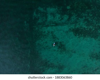 A couple floating with a standup paddleboard in Lake Constance Bodensee near Altnau Thurgau Switzerland - Powered by Shutterstock