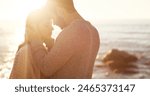 Couple, forehead and hug on beach together for romantic sunset, bonding in nature and love, Happy, man and woman embrace on ocean sand for holiday, adventure and summer travel or vacation in sunshine
