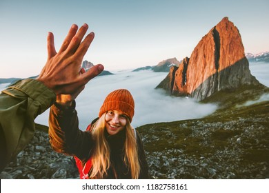 Couple friends giving five hands traveling outdoor hiking in Norway mountains adventure lifestyle positive emotions concept family together on journey vacations - Shutterstock ID 1182758161